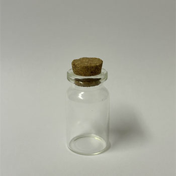 A glass bottle with a cork.