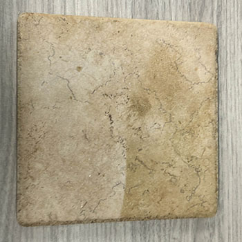 The tile has a matte, non-reflective surface with subtle veining patterns that give it a natural, stone-like appearance and add visual depth and interest.